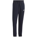 Adidas Spodnie męskie adidas Essentials Tapered Cuff 3 Stripes Pants granatowe GK8981 Adidas Spodnie męskie adidas Essentials Tapered Cuff 3 Stripes Pants granatowe GK8981