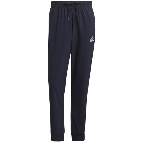 Adidas Spodnie męskie adidas Essentials Tapered Cuff 3 Stripes Pants granatowe GK8981 Adidas Spodnie męskie adidas Essentials Tapered Cuff 3 Stripes Pants granatowe GK8981