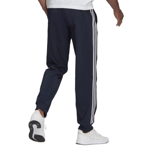 Adidas Spodnie męskie adidas Essentials Tapered Cuff 3 Stripes Pants granatowe GK8981 Adidas Spodnie męskie adidas Essentials Tapered Cuff 3 Stripes Pants granatowe GK8981