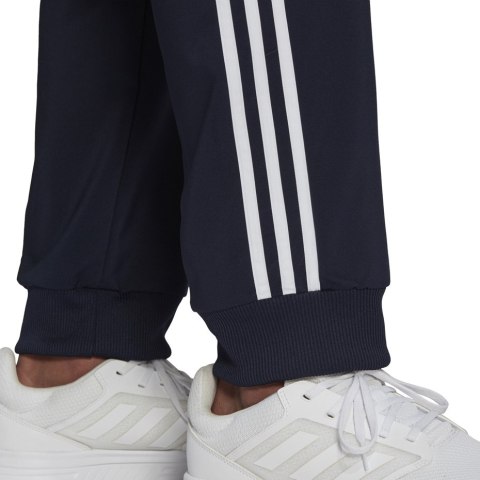 Adidas Spodnie męskie adidas Essentials Tapered Cuff 3 Stripes Pants granatowe GK8981 Adidas Spodnie męskie adidas Essentials Tapered Cuff 3 Stripes Pants granatowe GK8981