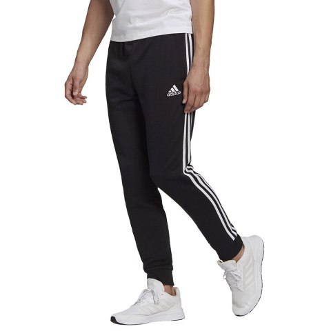 Adidas Spodnie męskie adidas Essentials Tapered Cuff 3 Stripes czarne GK8831 Adidas Spodnie męskie adidas Essentials Tapered Cuff 3 Stripes czarne GK8831