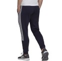 Adidas Spodnie męskie adidas Essentials Tapered Cuff 3 Stripes granatowe GK8977 Adidas Spodnie męskie adidas Essentials Tapered Cuff 3 Stripes granatowe GK8977