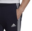 Adidas Spodnie męskie adidas Essentials Tapered Cuff 3 Stripes granatowe GK8977 Adidas Spodnie męskie adidas Essentials Tapered Cuff 3 Stripes granatowe GK8977