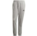 Adidas Spodnie męskie adidas Essentials Tapered Cuff 3 Stripes szare GK8889 Adidas Spodnie męskie adidas Essentials Tapered Cuff 3 Stripes szare GK8889