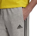 Adidas Spodnie męskie adidas Essentials Tapered Cuff 3 Stripes szare GK8889 Adidas Spodnie męskie adidas Essentials Tapered Cuff 3 Stripes szare GK8889