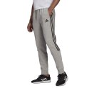 Adidas Spodnie męskie adidas Essentials Tapered Cuff 3 Stripes szare GK8976 Adidas Spodnie męskie adidas Essentials Tapered Cuff 3 Stripes szare GK8976