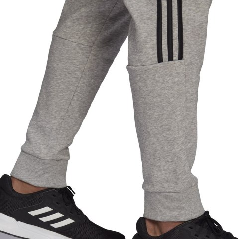 Adidas Spodnie męskie adidas Essentials Tapered Cuff 3 Stripes szare GK8976 Adidas Spodnie męskie adidas Essentials Tapered Cuff 3 Stripes szare GK8976