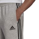 Adidas Spodnie męskie adidas Essentials Tapered Cuff 3 Stripes szare GK8976 Adidas Spodnie męskie adidas Essentials Tapered Cuff 3 Stripes szare GK8976