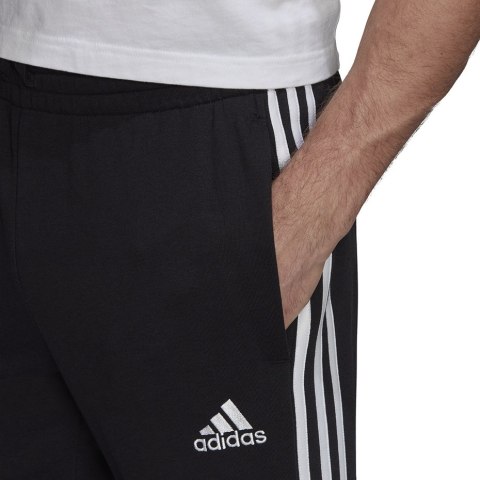 Adidas Spodnie męskie adidas Essentials Tapered Elasticcuff 3 Stripes Pant czarne GK8829 Adidas Spodnie męskie adidas Essentials Tapered Elasticcuff 3 Stripes Pant czarne GK8829