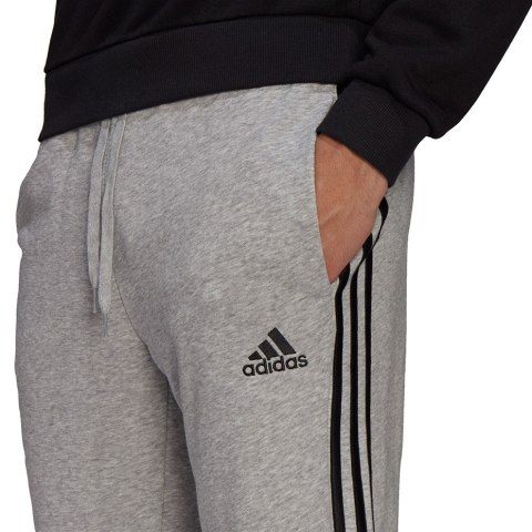 Adidas Spodnie męskie adidas Essentials Tapered Elastic Cuff 3 Stripes Pant szare GK9001 Adidas Spodnie męskie adidas Essentials Tapered Elastic Cuff 3 Stripes Pant szare GK9001