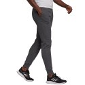 Adidas Spodnie damskie adidas Essentials Slim Tapered Cuffed Pant ciemnoszare HA0265 Adidas Spodnie damskie adidas Essentials Slim Tapered Cuffed Pant ciemnoszare HA0265