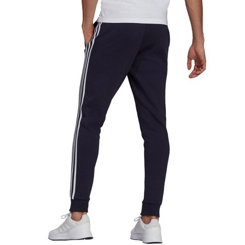 Adidas Spodnie męskie adidas Essentials Fleece Tapered Cuff 3-Band Pants granatowe GK8823 Adidas Spodnie męskie adidas Essentials Fleece Tapered Cuff 3-Band Pants granatowe GK8823