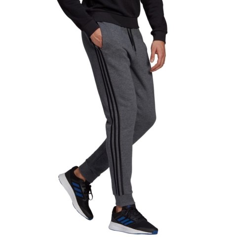 Adidas Spodnie męskie adidas Essentials Tapered Cuff 3 Stripes ciemnoszare GK8826 Adidas Spodnie męskie adidas Essentials Tapered Cuff 3 Stripes ciemnoszare GK8826