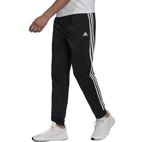 Adidas Spodnie męskie adidas Primegreen Essentials Warm-Up Tapered 3-Stripes Track czarne H46105 Adidas Spodnie męskie adidas Primegreen Essentials Warm-Up Tapered 3-Stripes Track czarne H46105