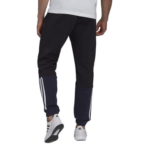 Adidas Spodnie męskie adidas Essentials Colorblock Fleece granatowe HK2884 Adidas Spodnie męskie adidas Essentials Colorblock Fleece granatowe HK2884