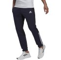 Adidas Spodnie męskie adidas Essentials Colorblock Fleece granatowe HK2884