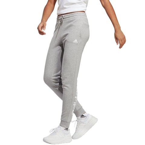 Adidas Spodnie damskie adidas Essentials Linear French Terry Cuffed szare IC8816 Adidas Spodnie damskie adidas Essentials Linear French Terry Cuffed szare IC8816