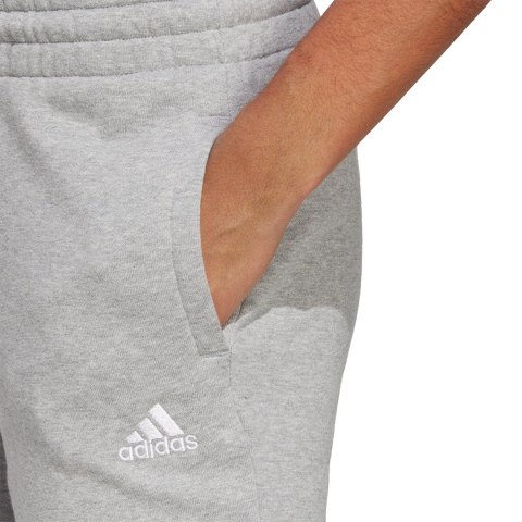 Adidas Spodnie damskie adidas Essentials Linear French Terry Cuffed szare IC8816 Adidas Spodnie damskie adidas Essentials Linear French Terry Cuffed szare IC8816
