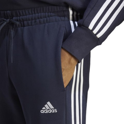 Adidas Spodnie męskie adidas Essentials French Terry Tapered Cuff 3-Stripes granatowe IC9406 Adidas Spodnie męskie adidas Essentials French Terry Tapered Cuff 3-Stripes granatowe IC9406
