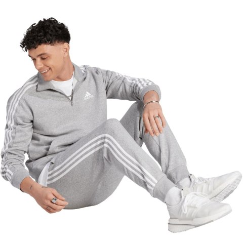 Adidas Spodnie męskie adidas Essentials Fleece 3-Stripes Tapered Cuff szare IJ6494 Adidas Spodnie męskie adidas Essentials Fleece 3-Stripes Tapered Cuff szare IJ6494