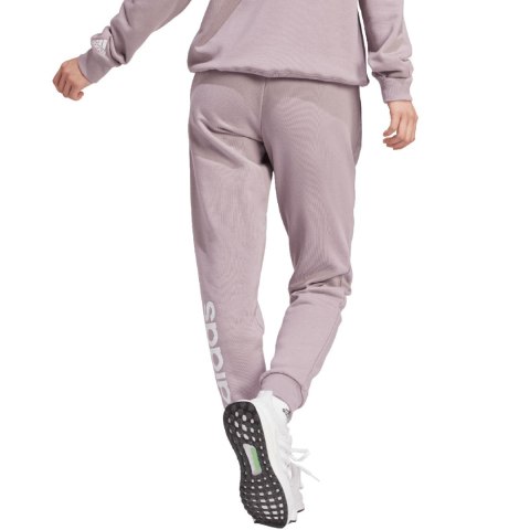 Adidas Spodnie damskie adidas Essentials Linear French Terry Cuffed fioletowe IS2105 Adidas Spodnie damskie adidas Essentials Linear French Terry Cuffed fioletowe IS2105