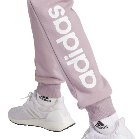Adidas Spodnie damskie adidas Essentials Linear French Terry Cuffed fioletowe IS2105 Adidas Spodnie damskie adidas Essentials Linear French Terry Cuffed fioletowe IS2105