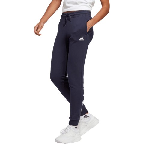 Adidas Spodnie damskie adidas Essentials Linear French Terry Cuffed granatowe IC6869 Adidas Spodnie damskie adidas Essentials Linear French Terry Cuffed granatowe IC6869