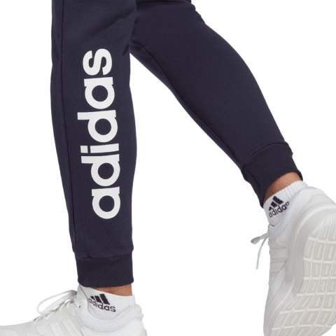 Adidas Spodnie damskie adidas Essentials Linear French Terry Cuffed granatowe IC6869 Adidas Spodnie damskie adidas Essentials Linear French Terry Cuffed granatowe IC6869