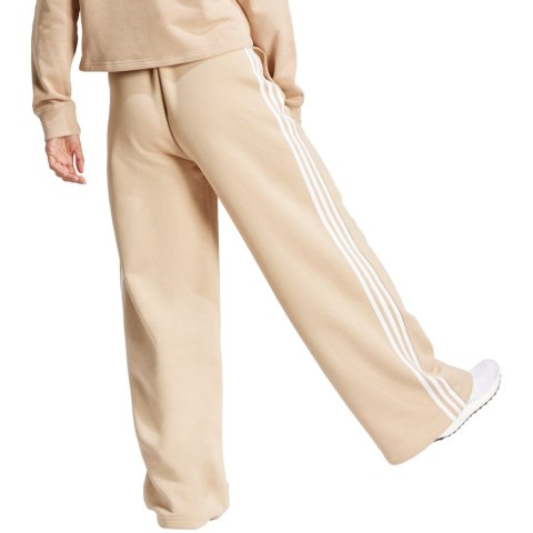 Adidas Spodnie damskie adidas Essentials 3-Stripes Fleece Wide beżowe IR5385 Adidas Spodnie damskie adidas Essentials 3-Stripes Fleece Wide beżowe IR5385